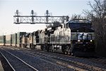 Westbound intermodal passes past the station